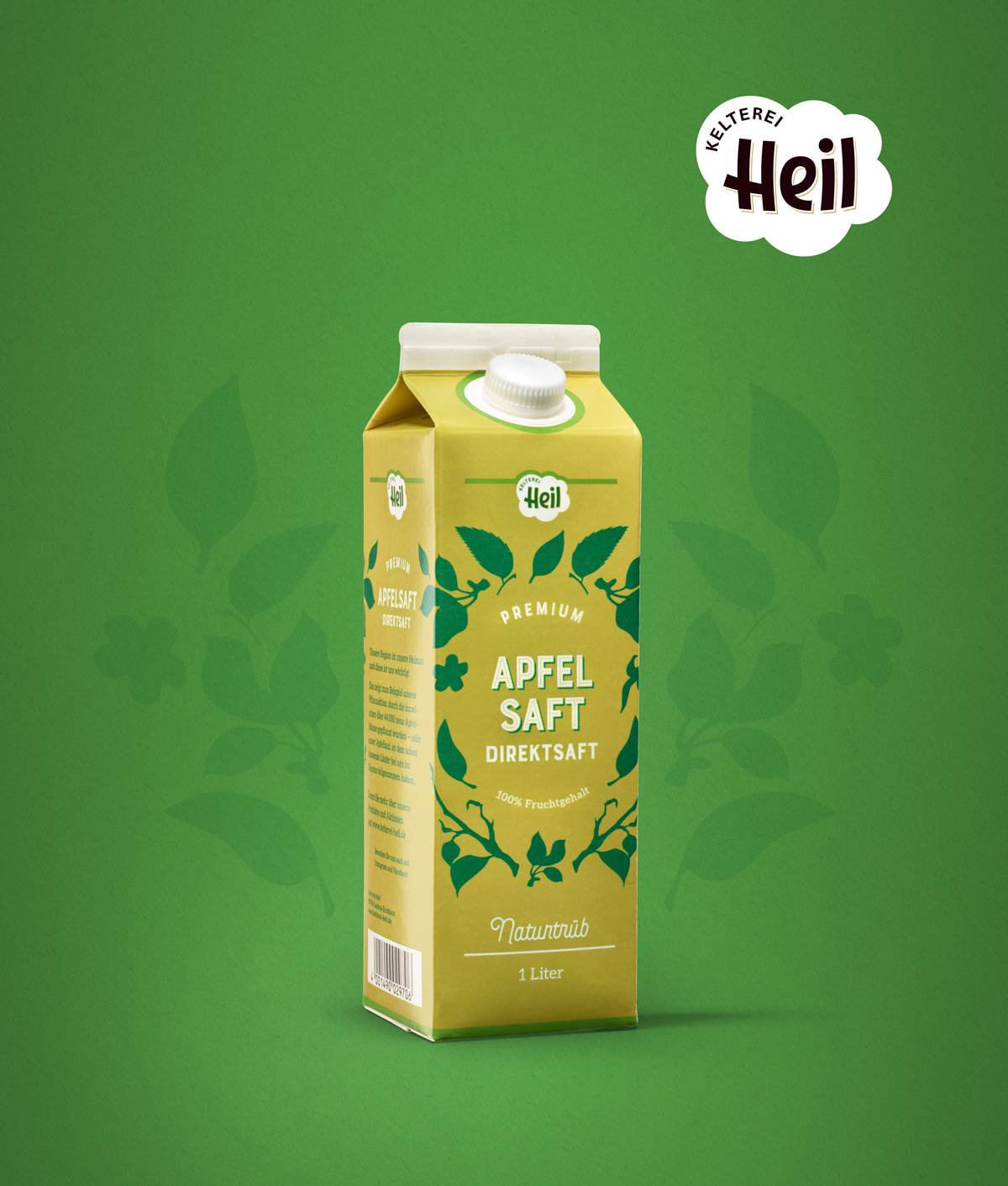 Gelber Getränkekarton „Apfelsaft Direktsaft“ der Marke Kelterei Heil auf grünem Hintergrund.