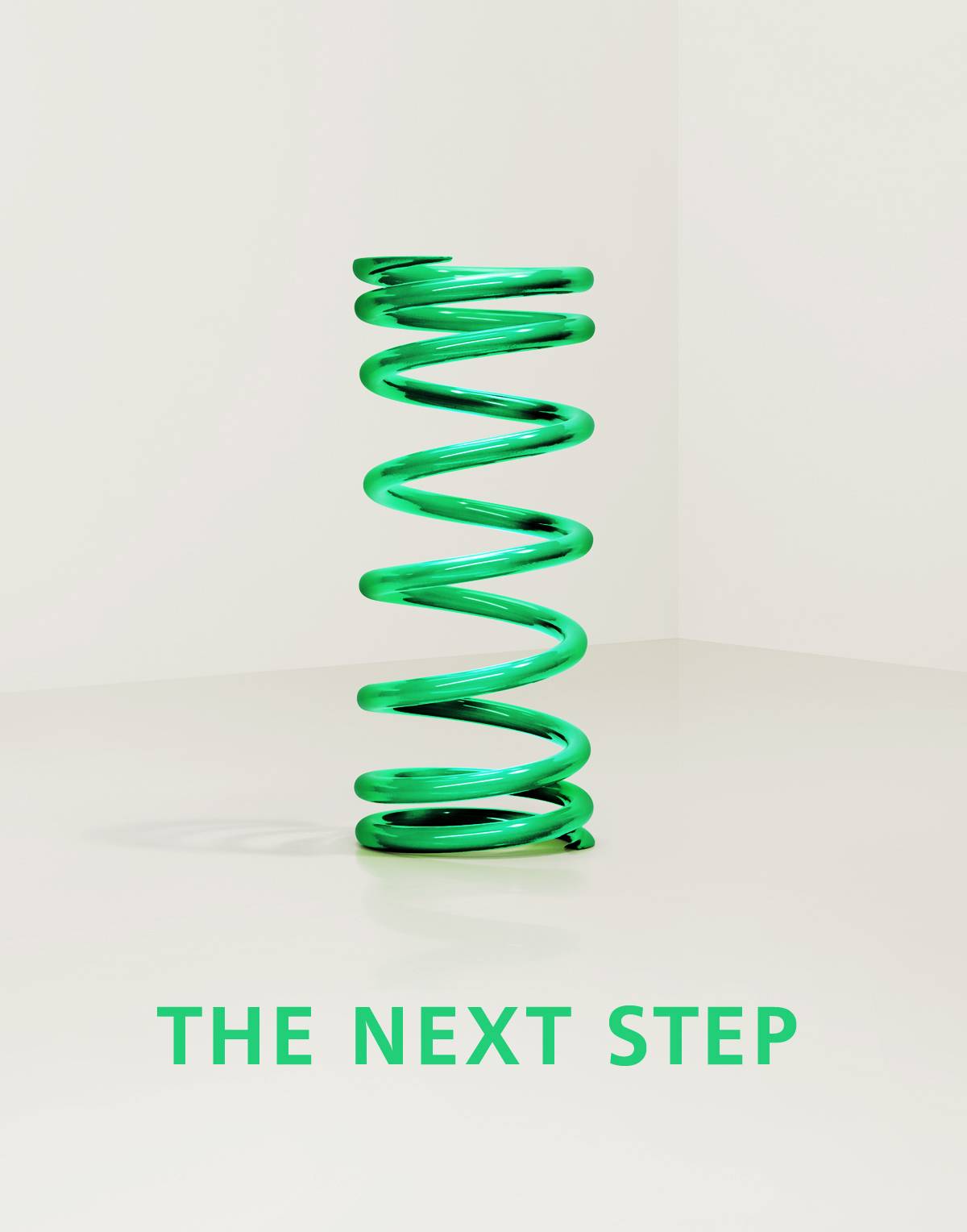 Grüne Metallfeder steht auf hellem Boden, darunter der Text „THE NEXT STEP“.
